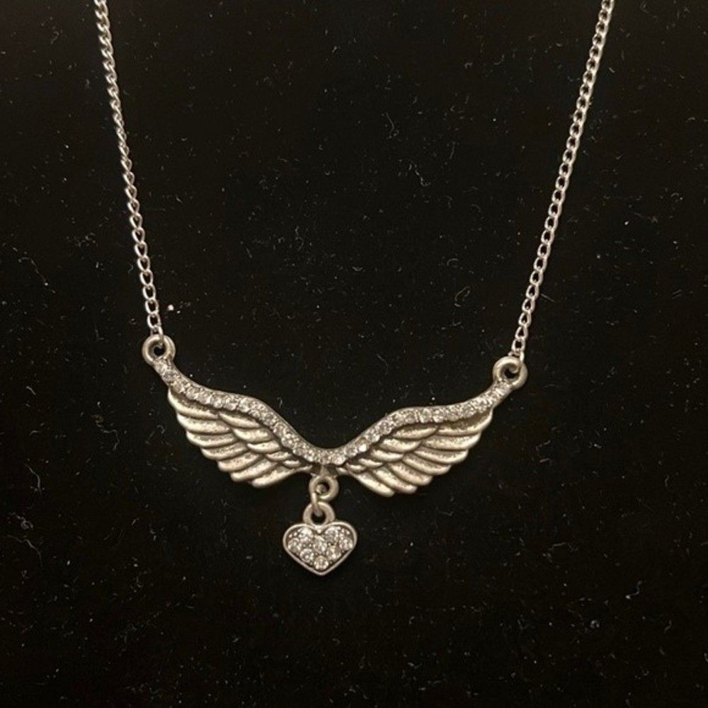 Handcrafted wing and heart pendant on 21 inch silver tone chain with extender